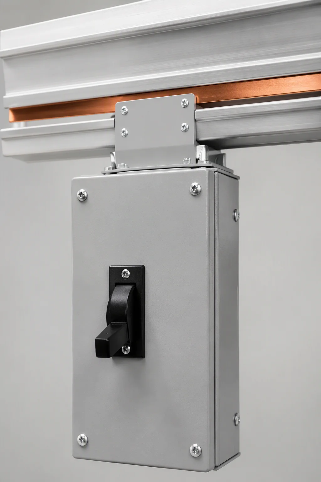 Tap-off box plugged into open-channel busway above a rack row, vertical view